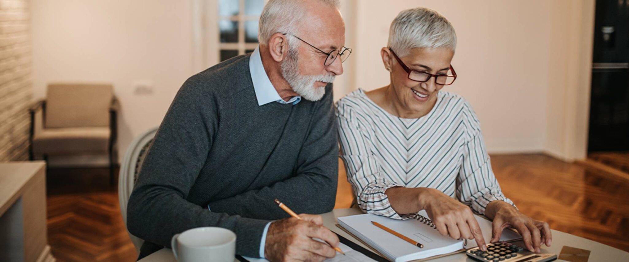 seniors calculating the cost of senior living