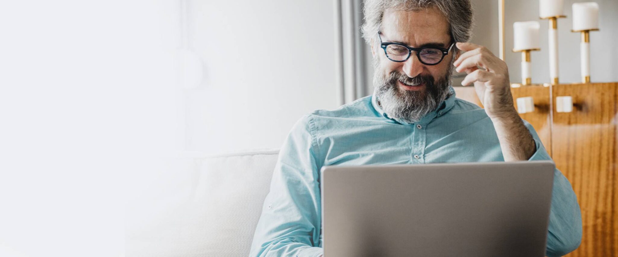 senior man looking at his laptop