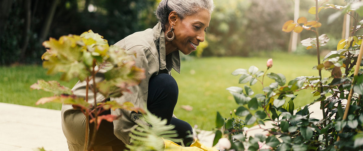 Senior woman taking care of her garden
