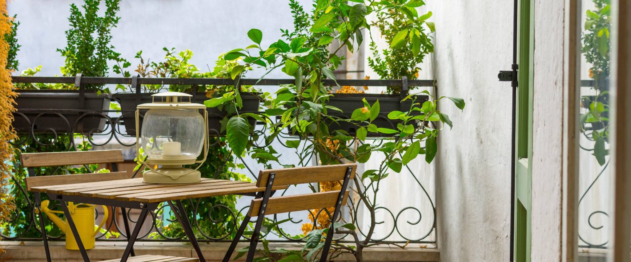 decorated balcony with lots of plants and greenery