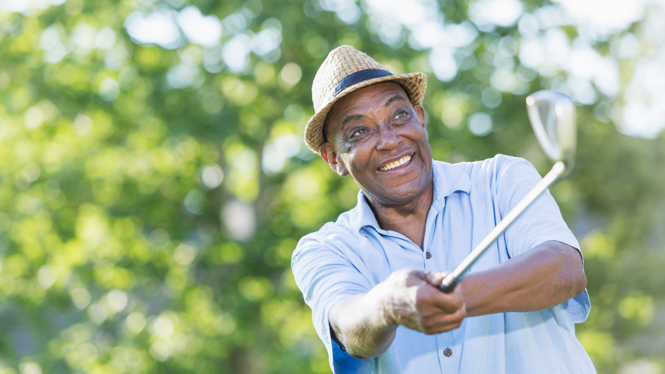 Blog Images (89) Close up of senior smiling as he hits his golf ball