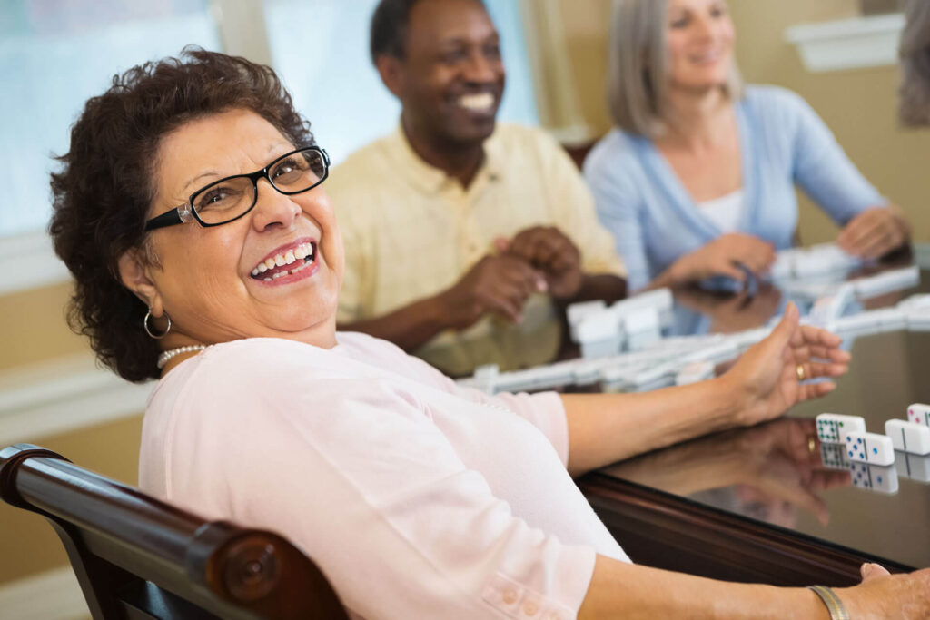 happy senior lady smiling at the camera while laughing