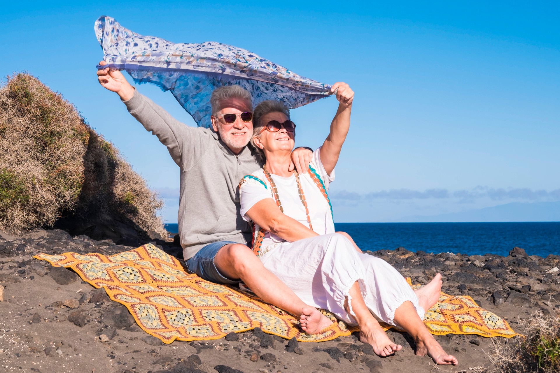 Senior couple enjoying the beach.